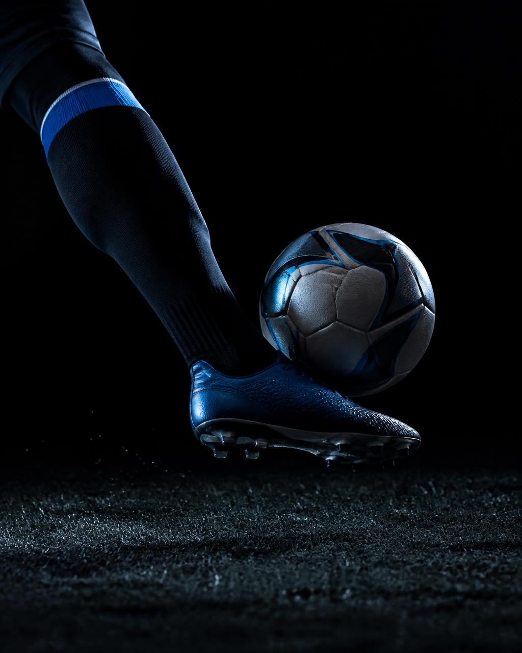 Close-up of a player cushioning the ball with the instep